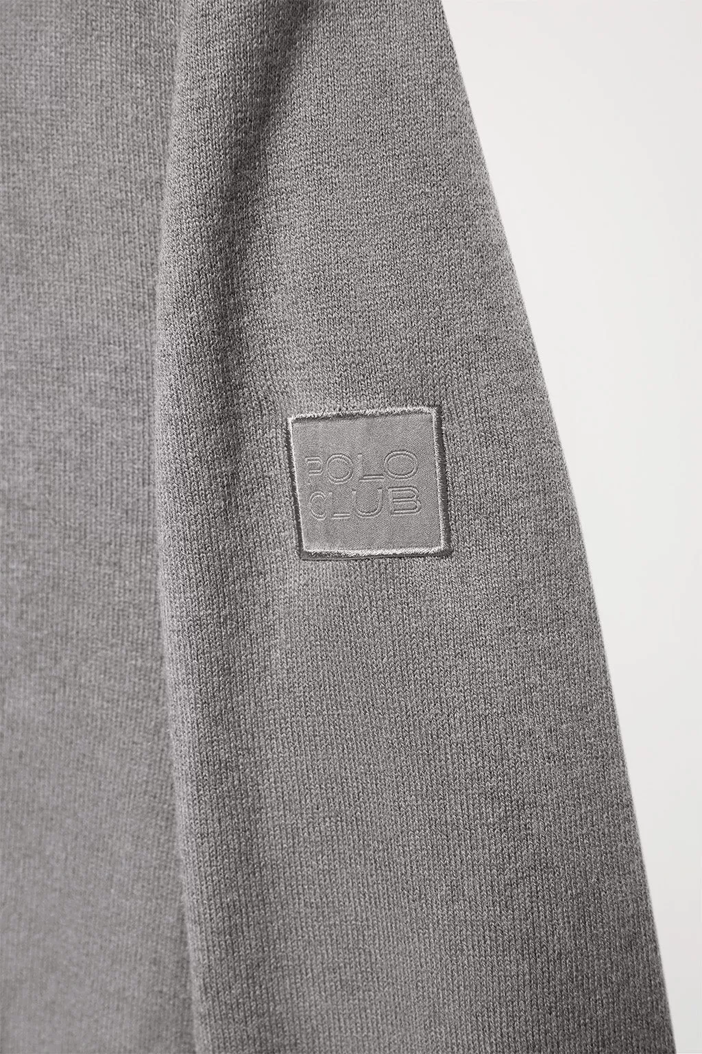 Cárdigan de cashmere gris con cremallera y logo en la manga